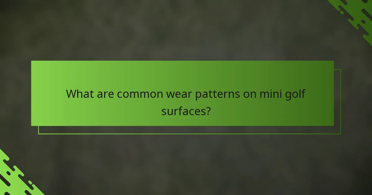 What are common wear patterns on mini golf surfaces?